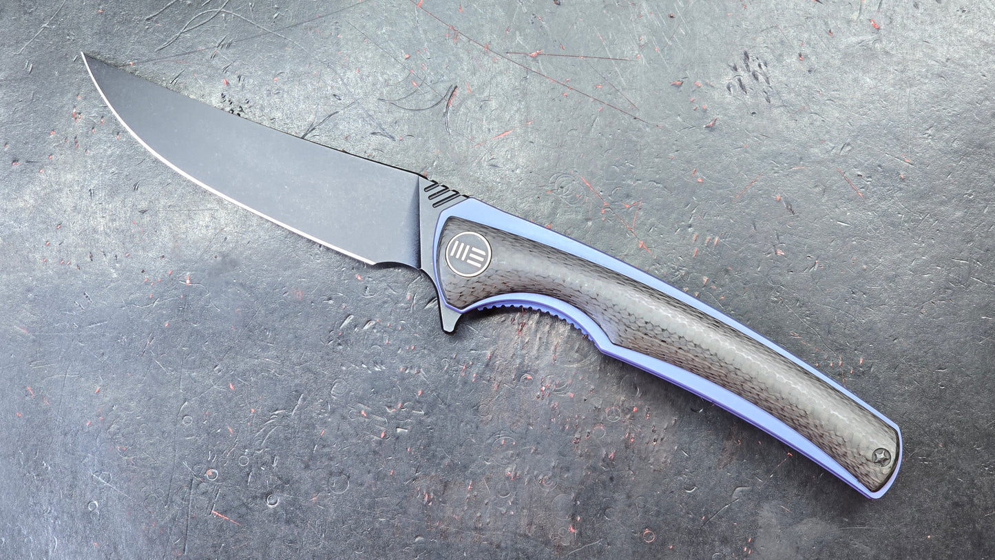 We Knife 704CF Black Carbon Fiber Over Blue Titanium Handle 3.6” Bohler M390 (NEW)