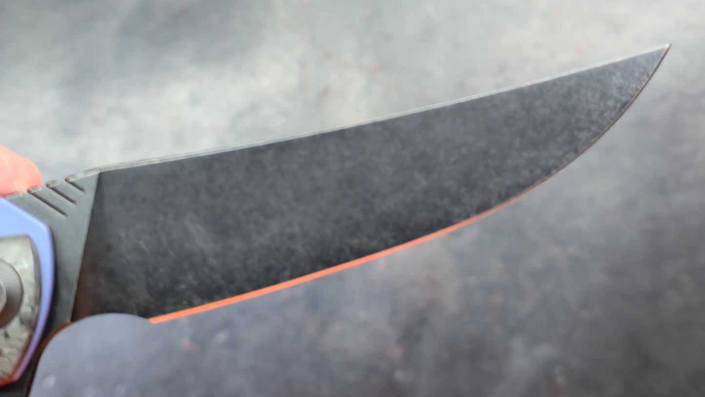 We Knife 704CF Black Carbon Fiber Over Blue Titanium Handle 3.6” Bohler M390 (NEW)