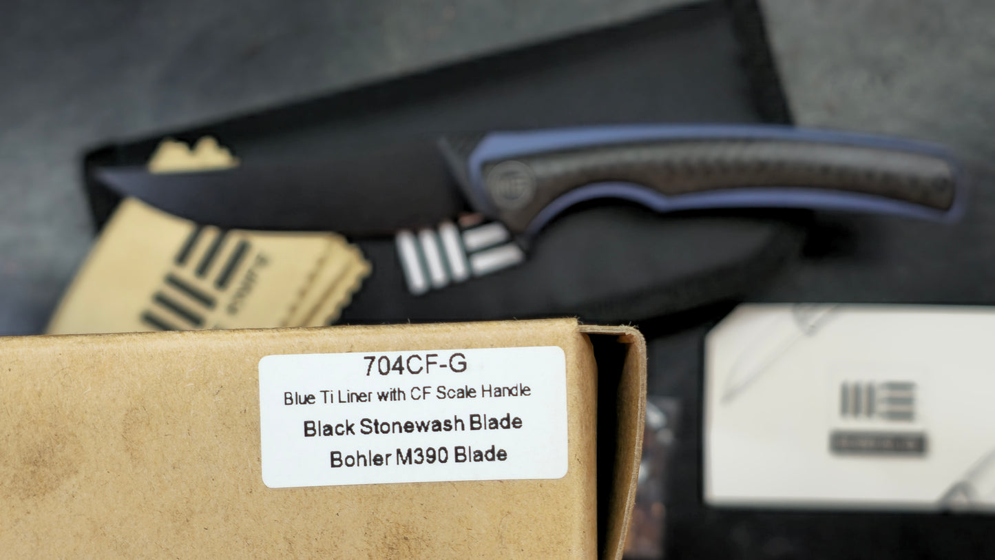 We Knife 704CF Black Carbon Fiber Over Blue Titanium Handle 3.6” Bohler M390 (NEW)