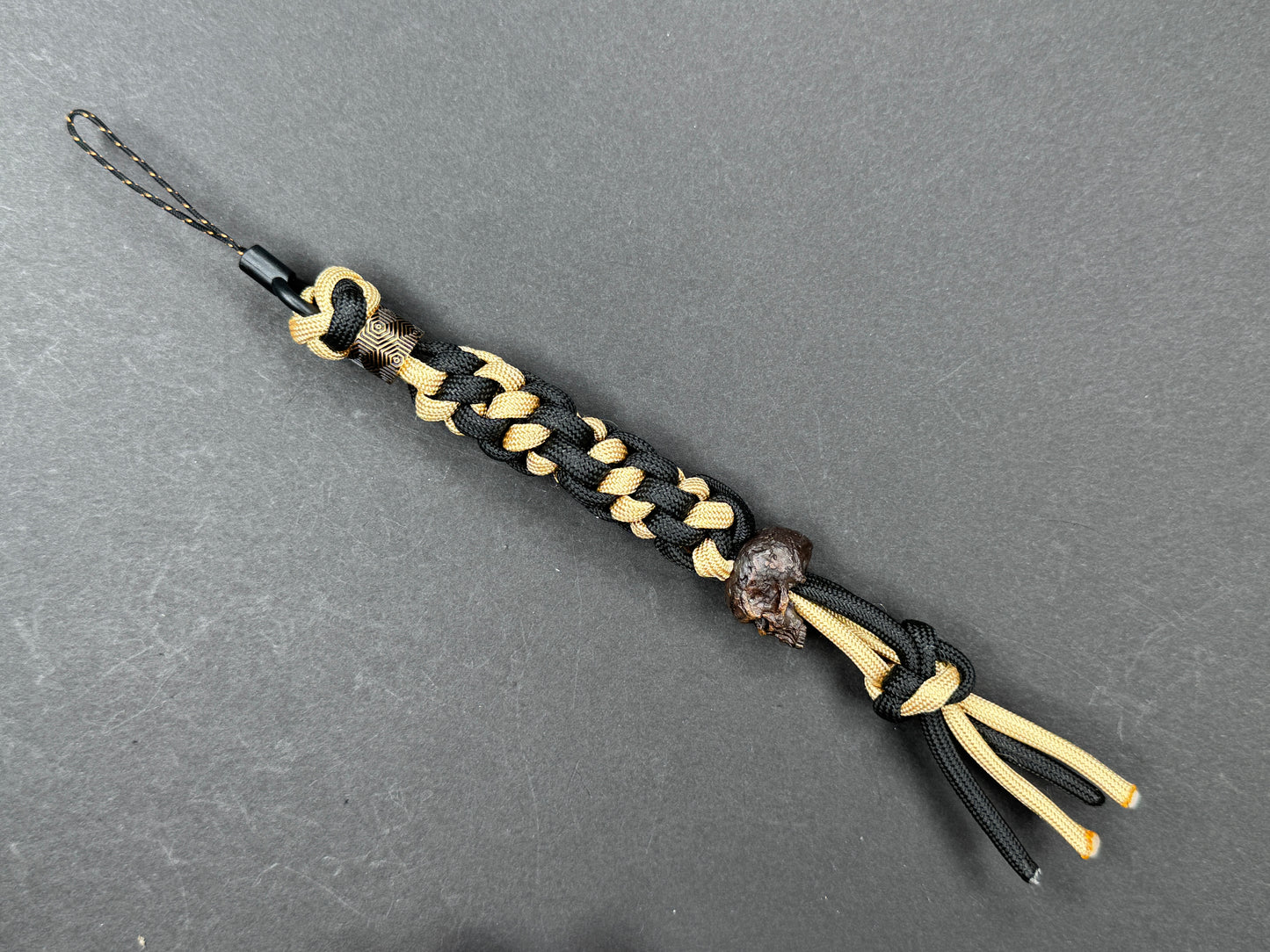 Custom Knife Lanyard โ Black & Gold Paracord with Handmade Skull Bead