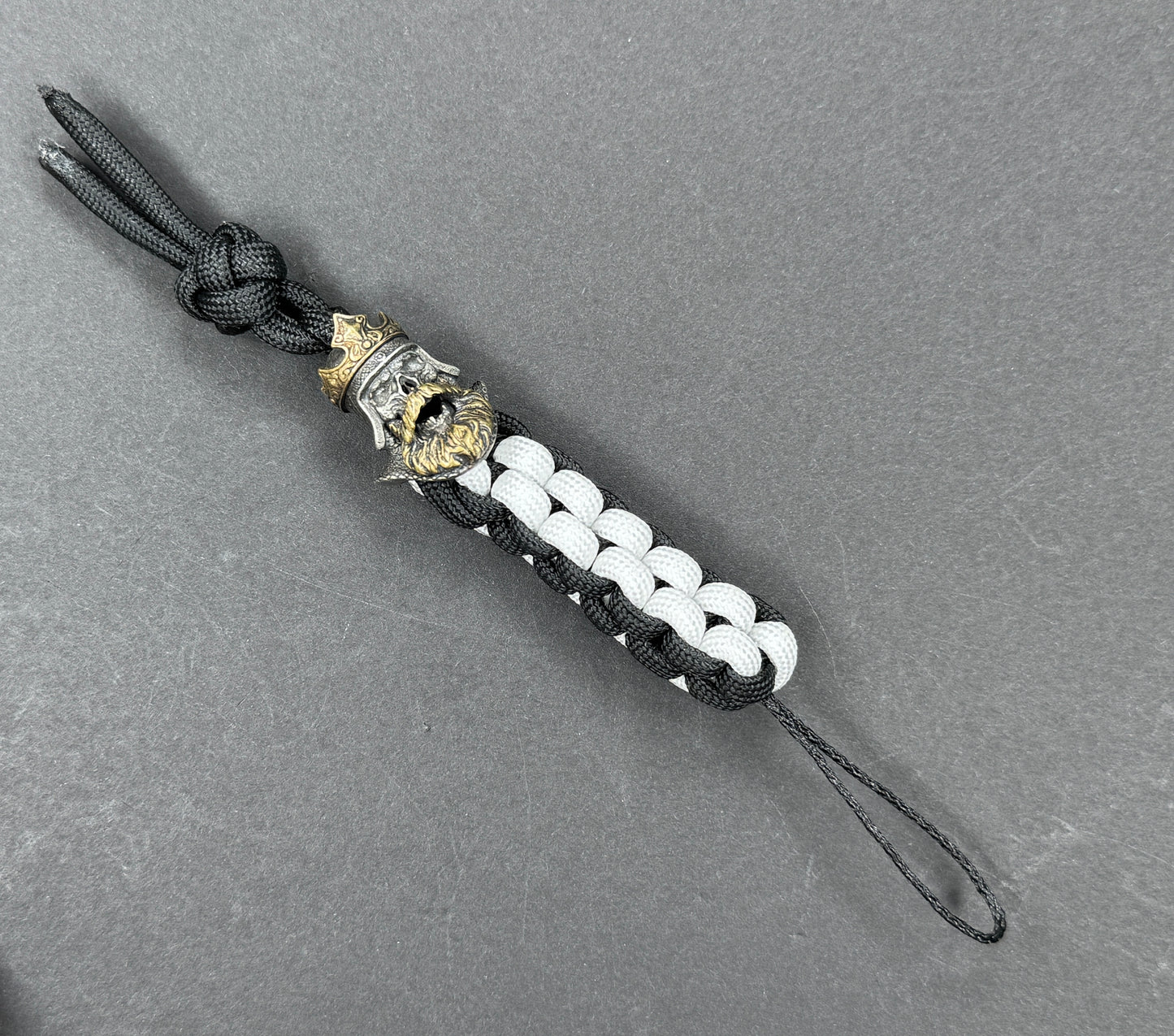 Custom Knife Lanyard โ Black & White Paracord with Intricate Skull King Bead