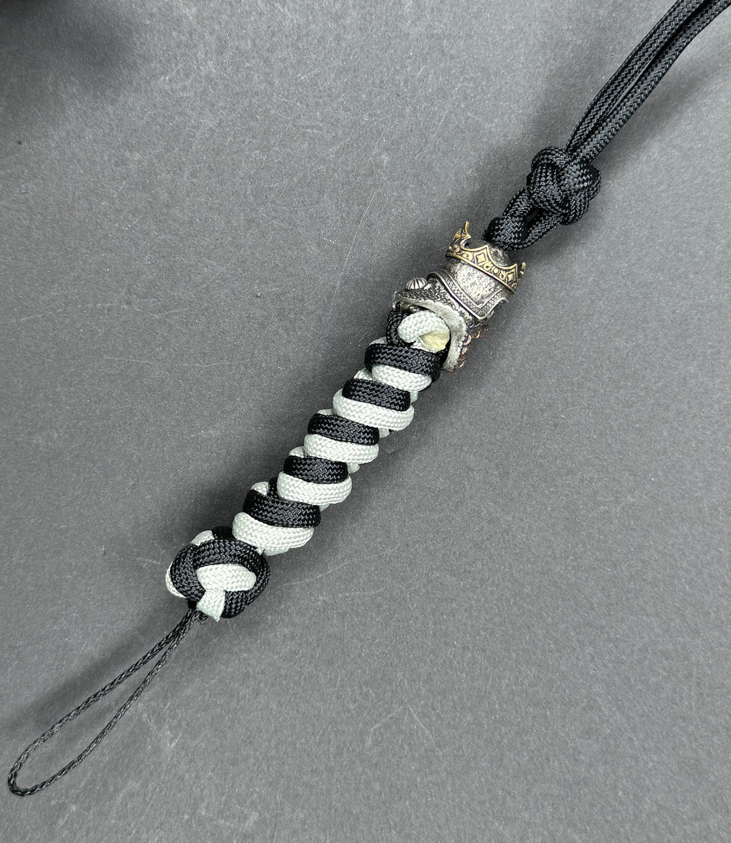Custom Knife Lanyard โ Black & White Paracord with Intricate Skull King Bead