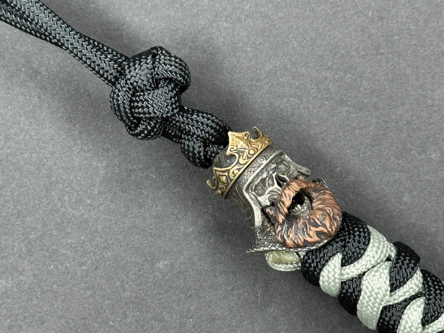 Custom Knife Lanyard โ Black & White Paracord with Intricate Skull King Bead