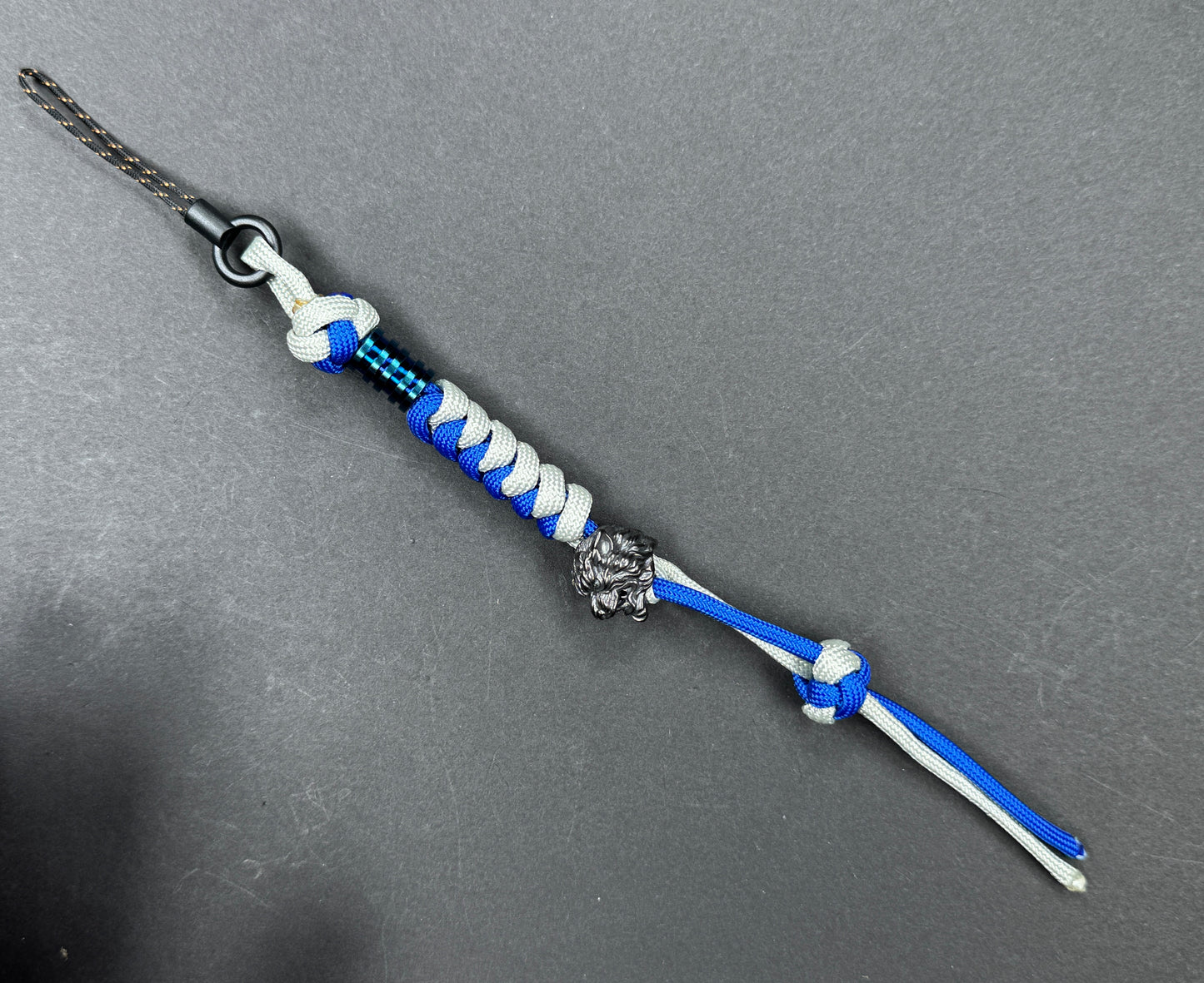 Custom Knife Lanyard โ Blue & White Paracord with Intricate Tiger Bead