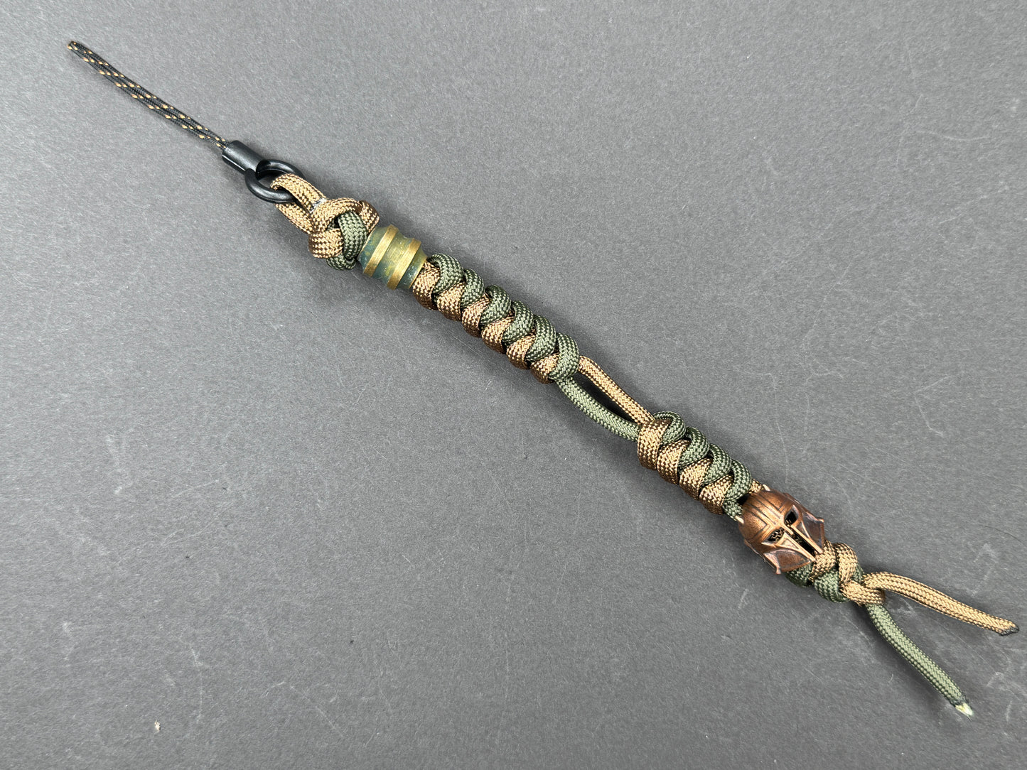 Custom Knife Lanyard โ Brown & Green Paracord with Intricate Warrior Helmet Bead