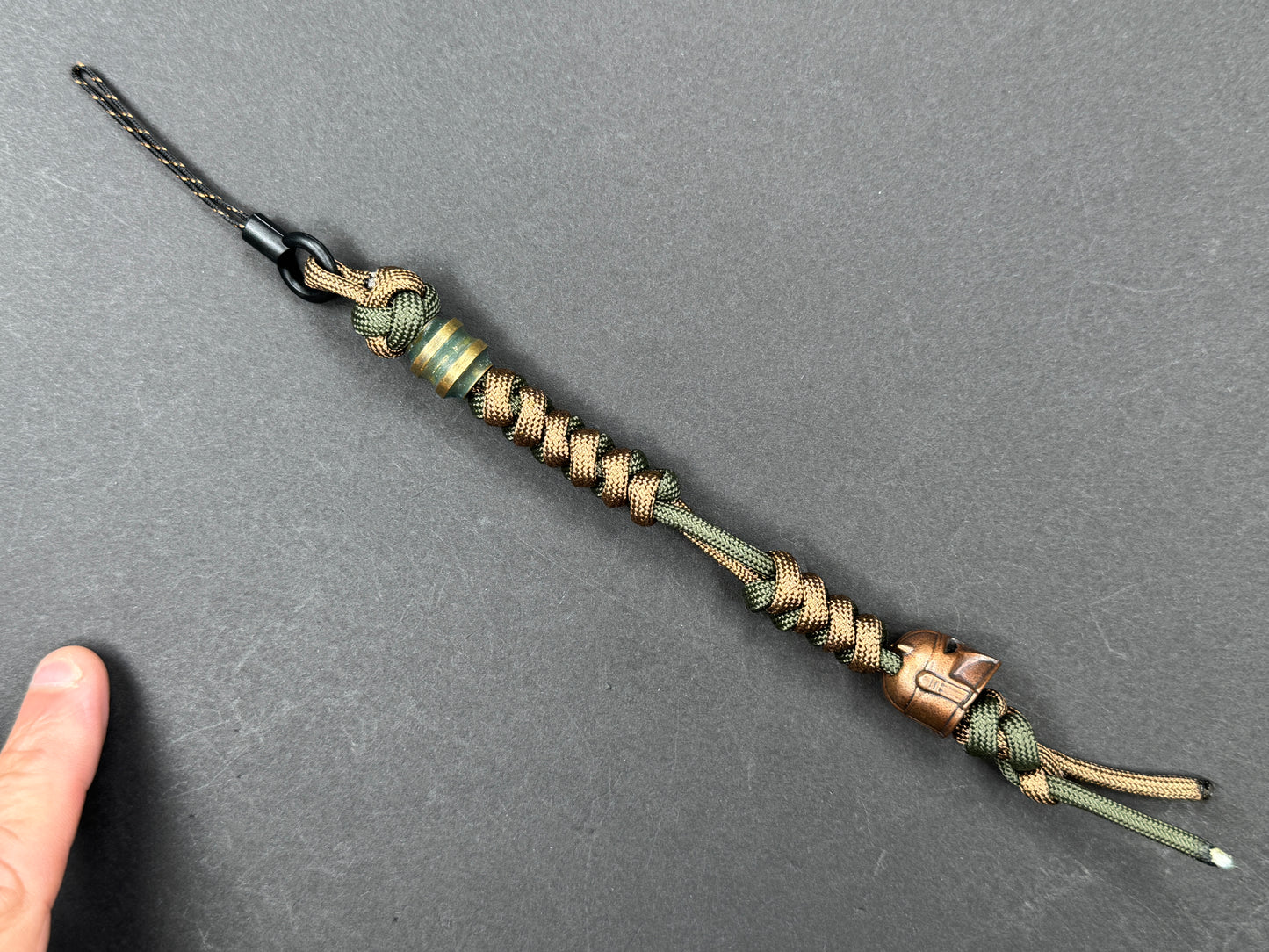 Custom Knife Lanyard โ Brown & Green Paracord with Intricate Warrior Helmet Bead