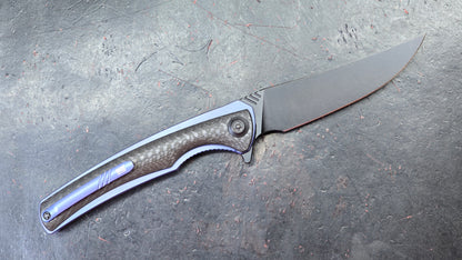 We Knife 704CF Black Carbon Fiber Over Blue Titanium Handle 3.6” Bohler M390 (NEW)