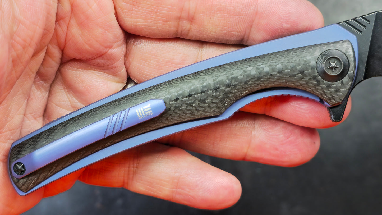 We Knife 704CF Black Carbon Fiber Over Blue Titanium Handle 3.6” Bohler M390 (NEW)