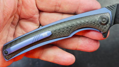 We Knife 704CF Black Carbon Fiber Over Blue Titanium Handle 3.6” Bohler M390 (NEW)