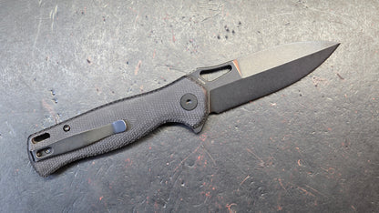 Trivisa Crateris-04B Button Lock Black Micarta Handle 14C28N Blade