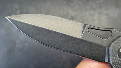 Trivisa Crateris-04B Button Lock Black Micarta Handle 14C28N Blade