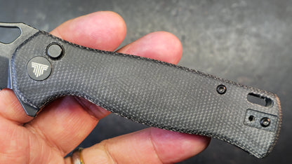 Trivisa Crateris-04B Button Lock Black Micarta Handle 14C28N Blade