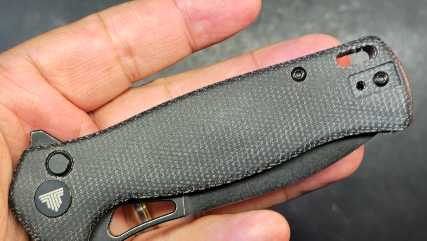 Trivisa Crateris-04B Button Lock Black Micarta Handle 14C28N Blade