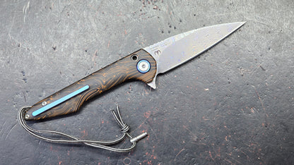 ArtisanCutlery Small Archaeo Double Detent Slipjoint Orange/Black G10 VG-10 Raindrop Damascus Blade,