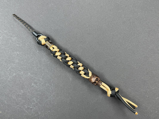 Custom Knife Lanyard – Black & Gold Paracord with Handmade Skull Bead