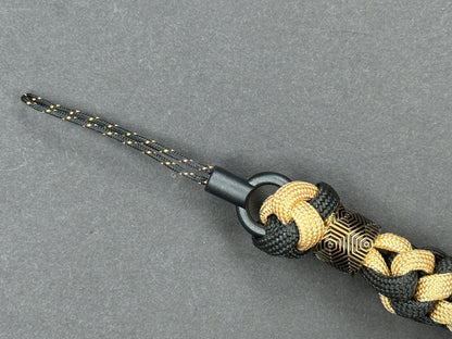 Custom Knife Lanyard – Black & Gold Paracord with Handmade Skull Bead