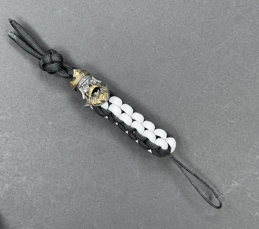 Custom Knife Lanyard – Black & White Paracord with Intricate Skull King Bead