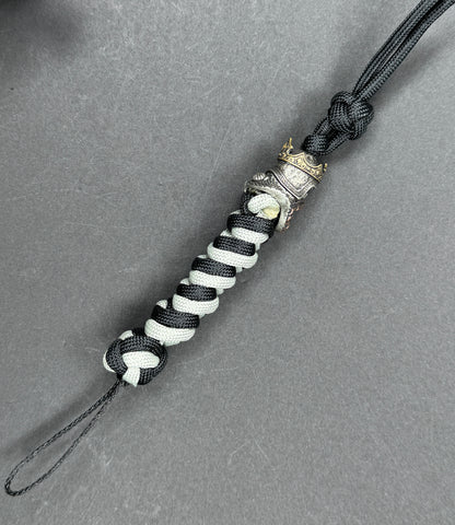Custom Knife Lanyard – Black & White Paracord with Intricate Skull King Bead
