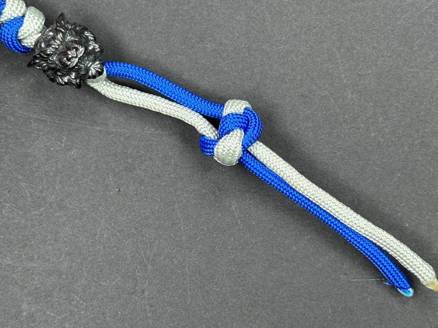 Custom Knife Lanyard – Blue & White Paracord with Intricate Tiger Bead